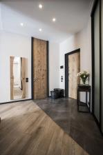 Стики підлогових покриттів без порога: Т-профіль, корковий компенсатор, приховані профілі